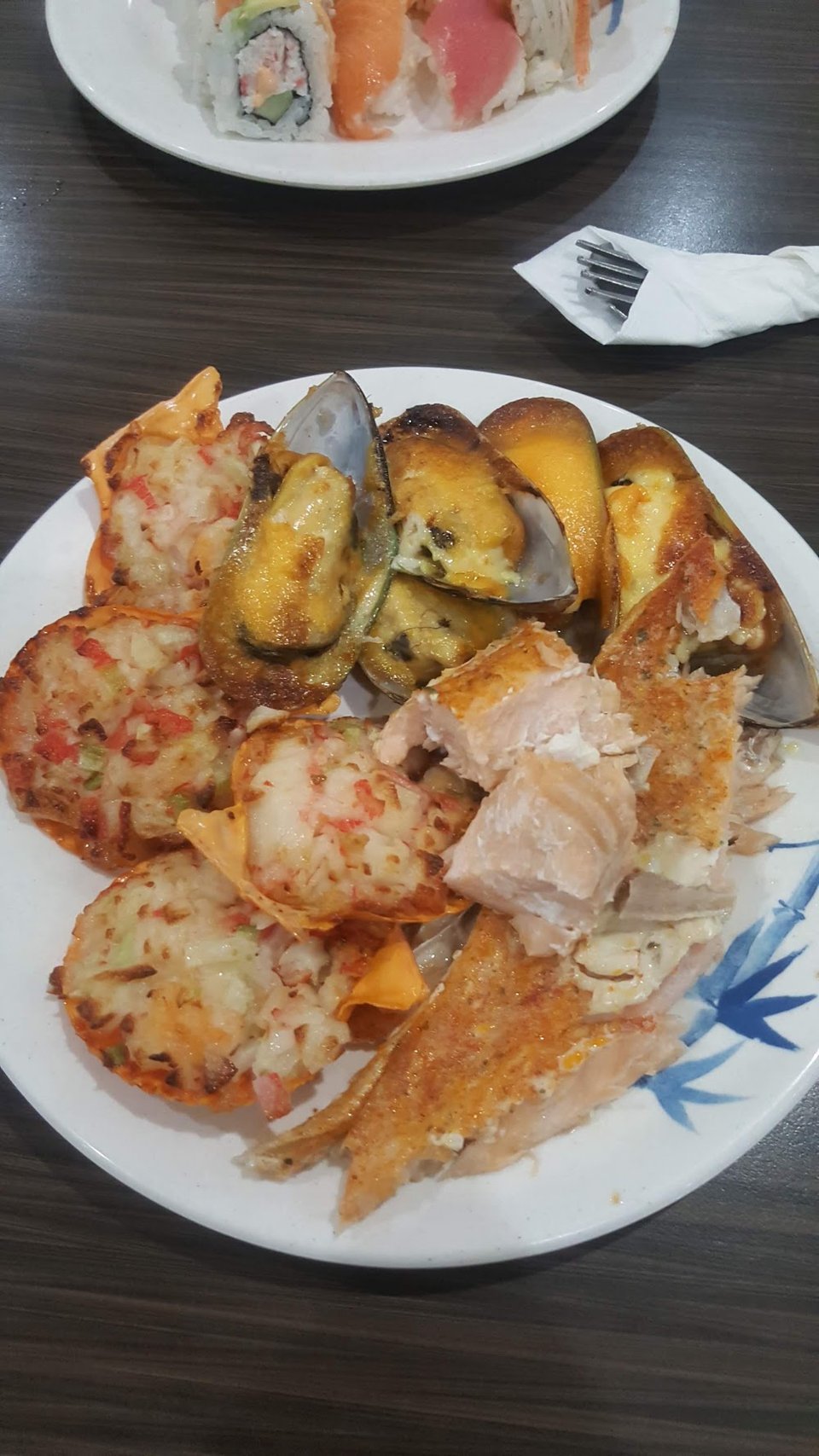 Printed menu with crab and sashimi items