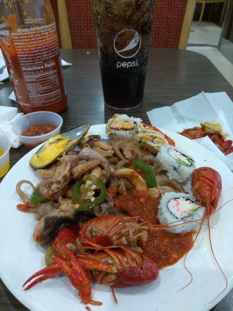 Printed menu with crab and sashimi items